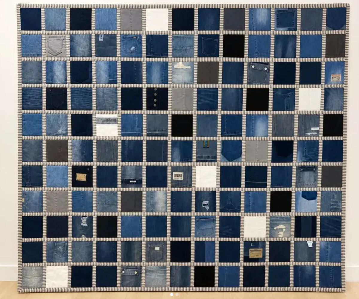 Memory quilt made from the jeans of several family members, with ticking stripe sashing